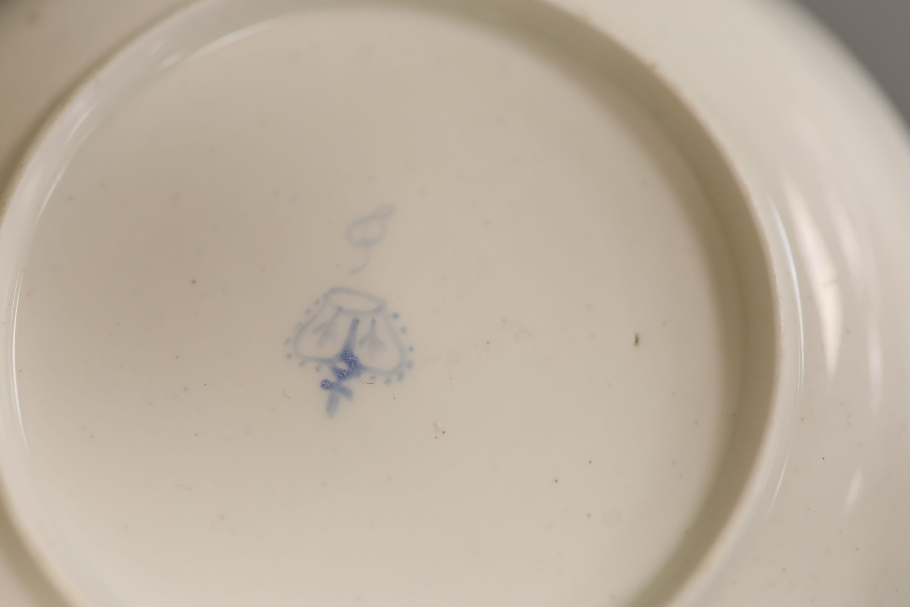 A Chelsea Derby teabowl and saucer painted with flowers, c.1778, blue Crown Derby mark with no batons, diameter 13cm